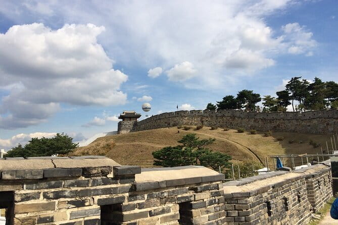 Day Tour of Suwon Hwaseong Fortress Starfield Waujeongsa Temple - Hwaseong Fortress, where the day earns its historical weight