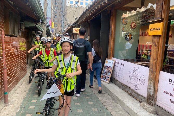 Market Food Tour & Evening E-bike Ride in Seoul - Bukchon by electric bike, including the quieter upper lanes