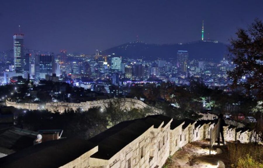 Seoul: Nighttime Tour of Palace, Market, Naksan Park & More - A quiet walk beside Cheonggyecheon Stream